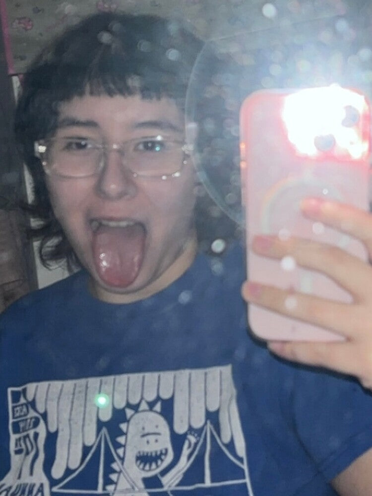 me with my tongue out with the flash on or whatever by puckizzluck