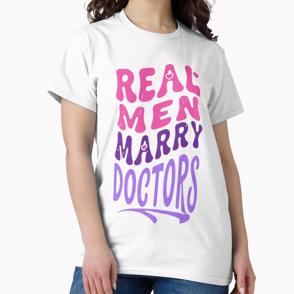 Real Men Marry Doctors Essential T-Shirt by puurfectcat