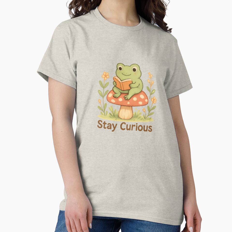 Cute Frog Reading Book – Stay Curious by Snacky Paws