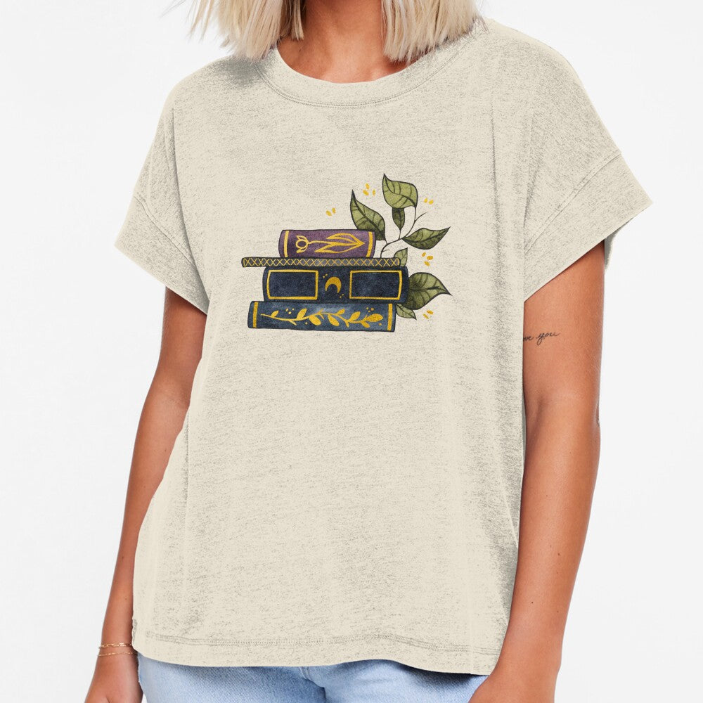 Dark book stack with gold details and leaves by Ellen Wilberg
